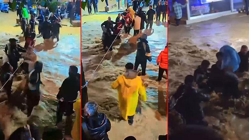 Sarıyer’de yollar göle döndü: Karşıya geçmek için halata tutundular